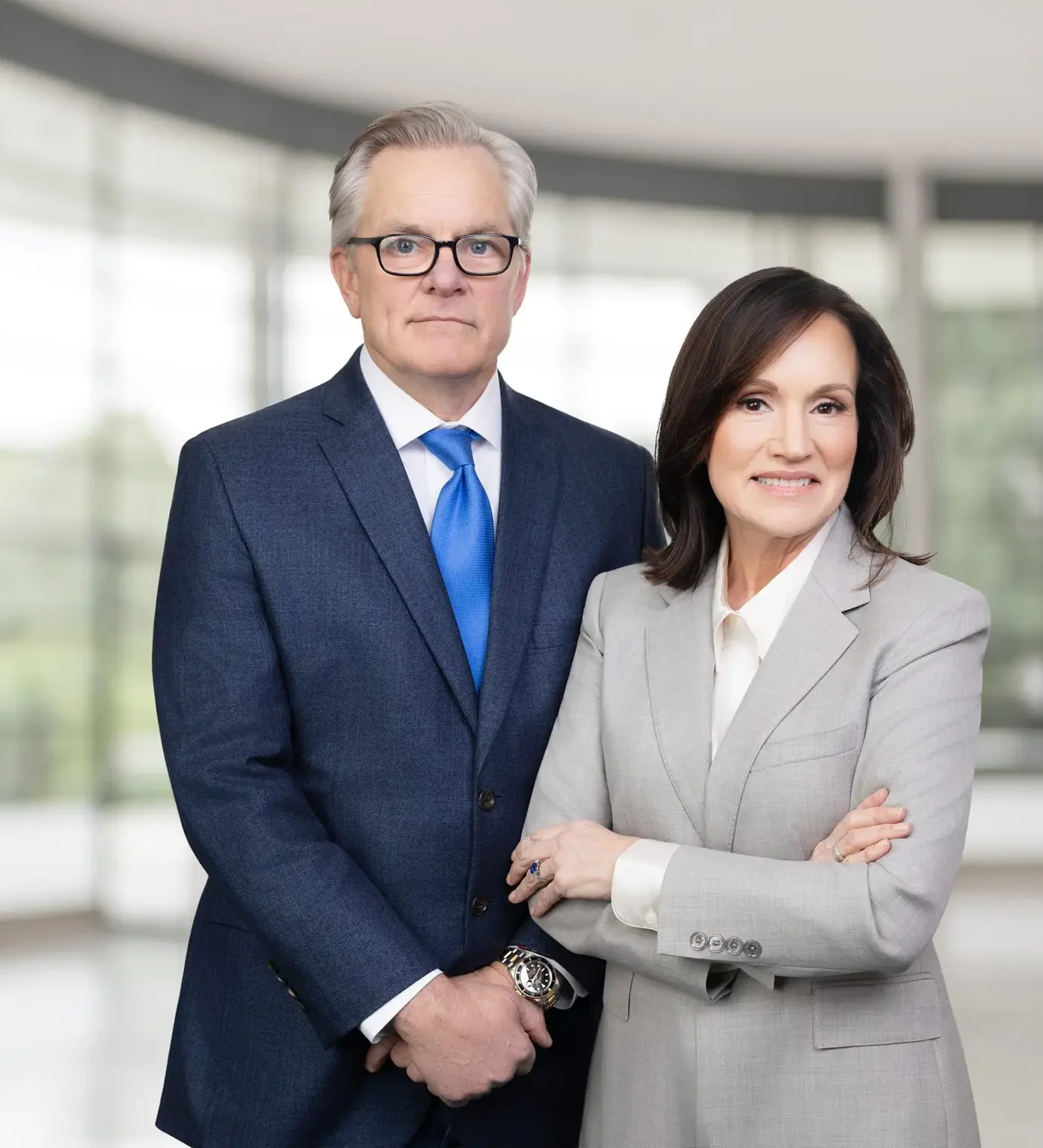 Executive team headshot of two business leaders photographed on location in a Mandeville, Louisiana office