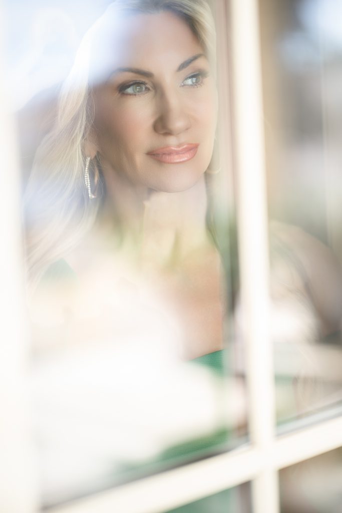 beautiful portrait of a women in a window