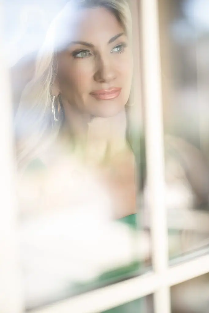 beautiful portrait of a women in a window