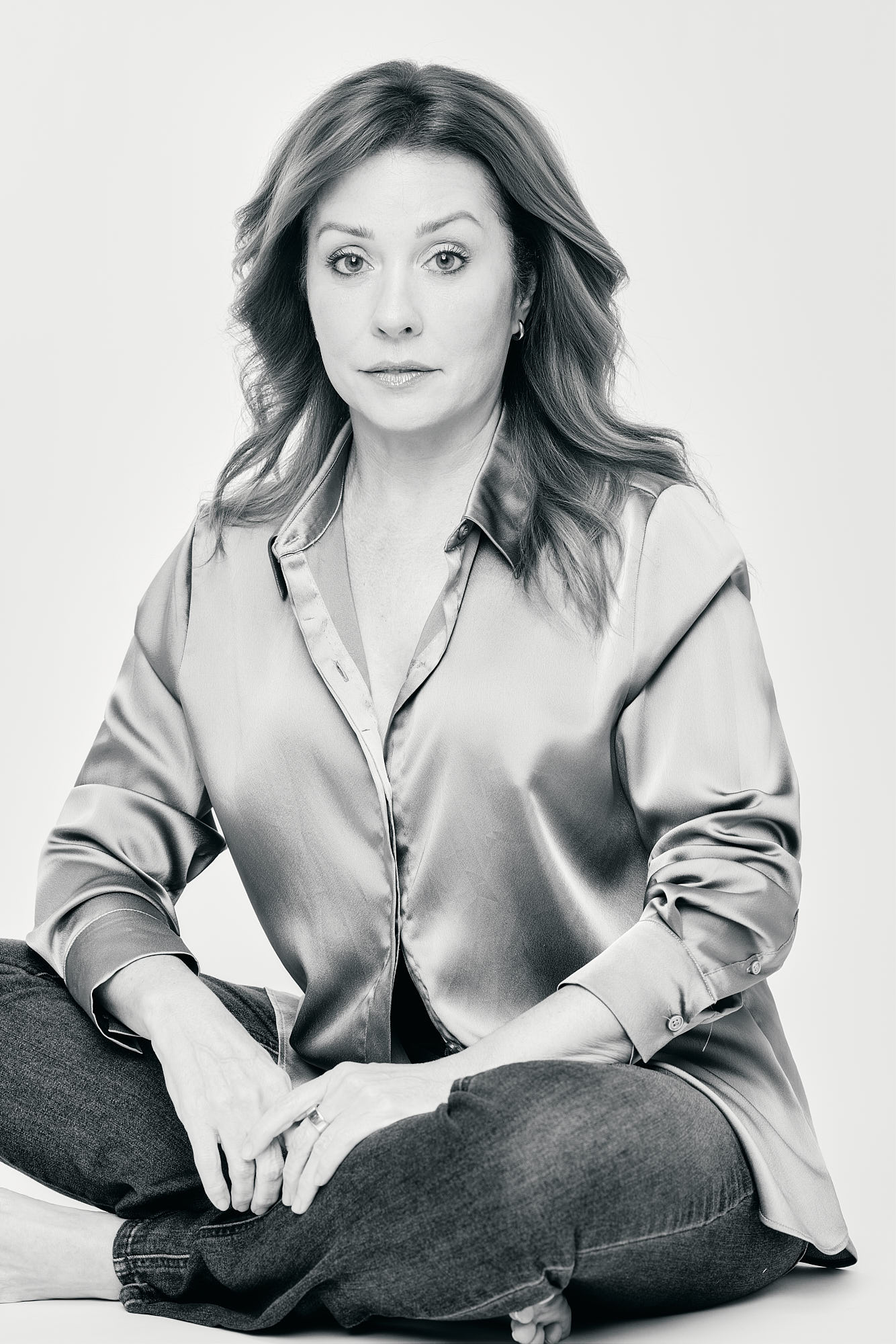 Black and white editorial portrait of a woman in a satin blouse, Bellus Photography, Mandeville
